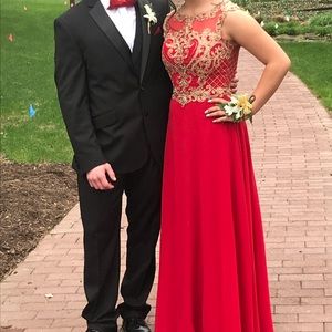 Red and gold prom dress with lace appliqués.